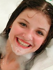 Adorable teen having fun in a bubble bath